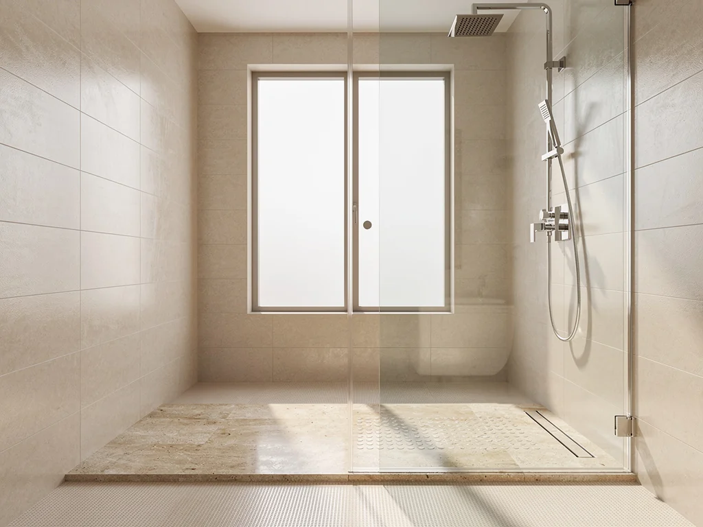 Douche à l'italienne sécurisée avec sol antidérapant et large paroi vitrée transparente